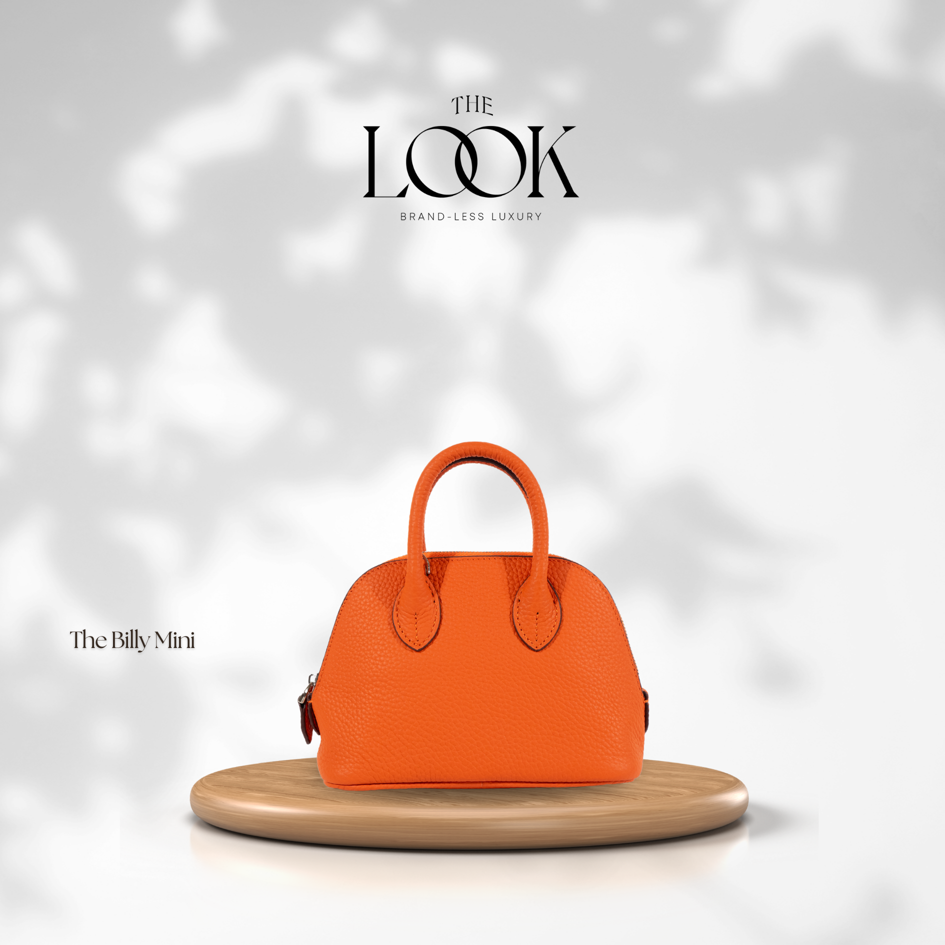The Mini Billy Dome Crossbody in Tangerine by The Look